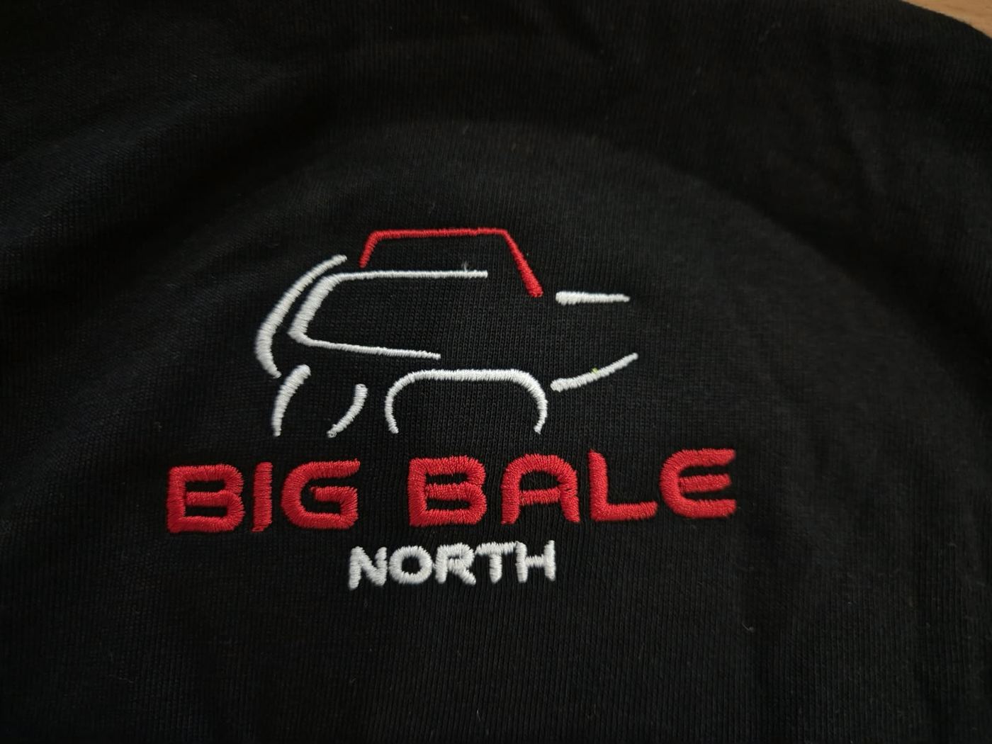 Big Bale North logo embroidered in red and white