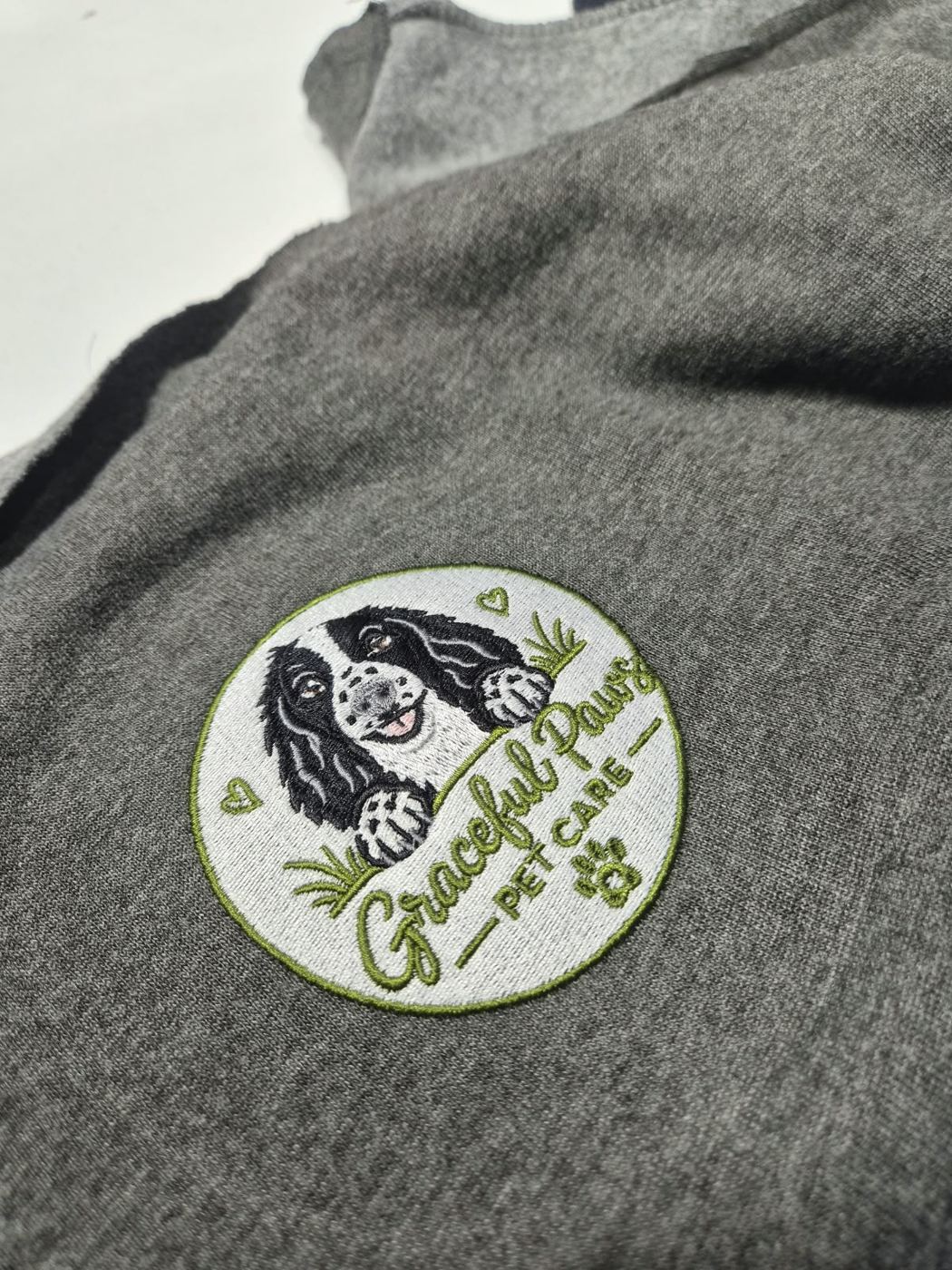 Graceful Paws circular logo embroidered on grey